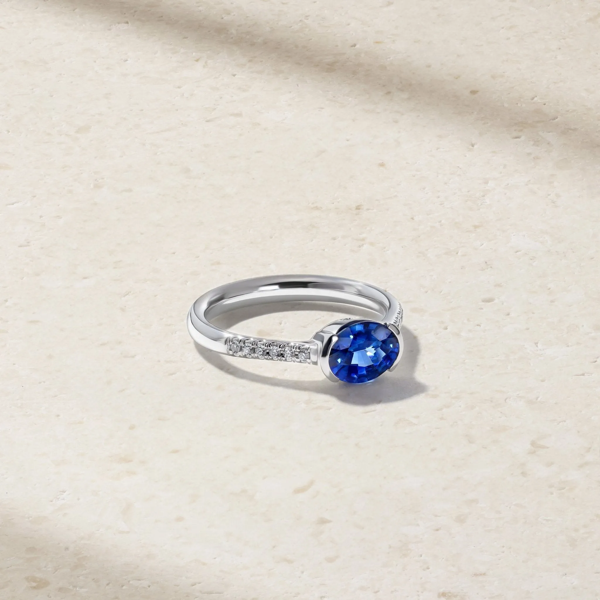 East-West Sapphire and Diamond Half Bezel Ring