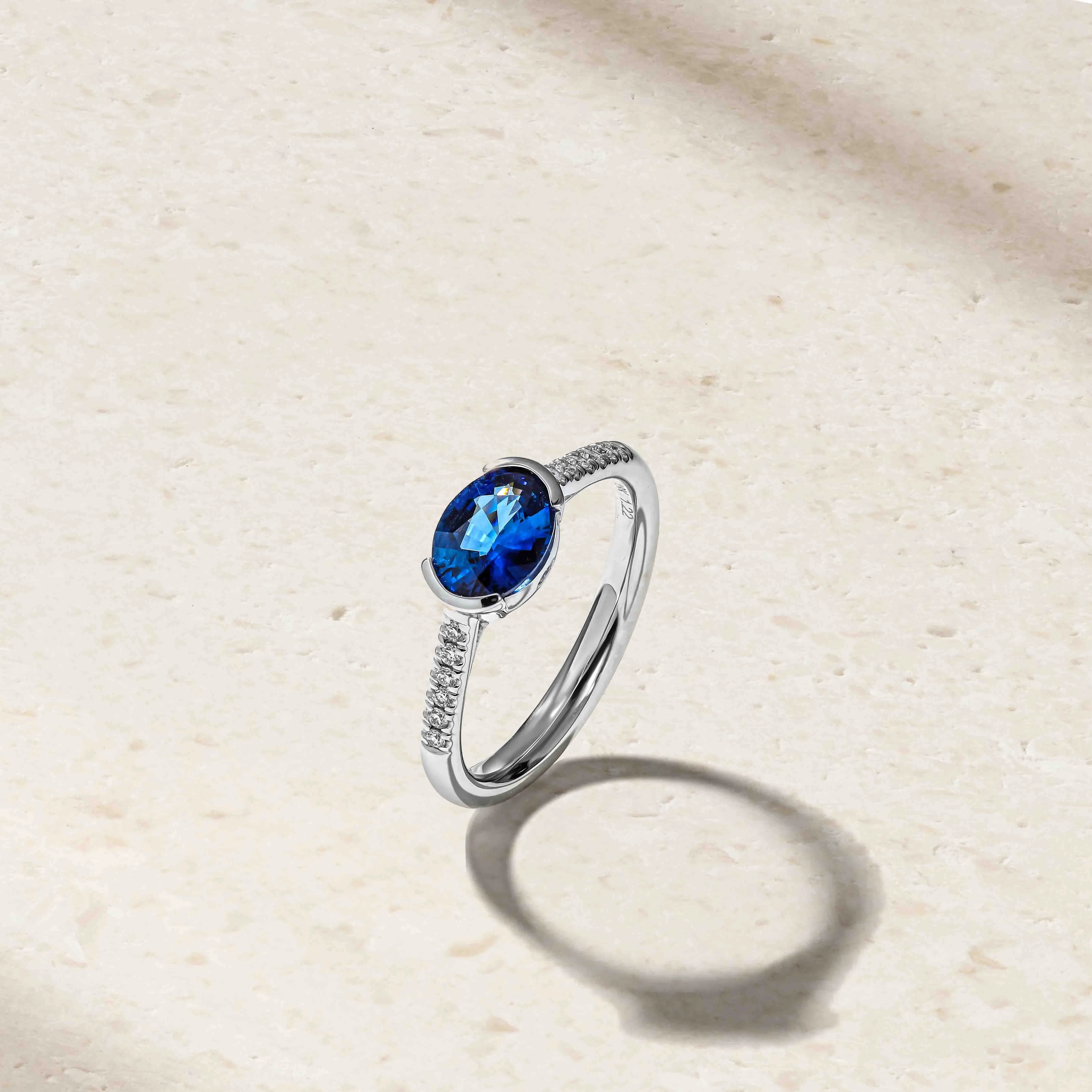 East-West Sapphire and Diamond Half Bezel Ring